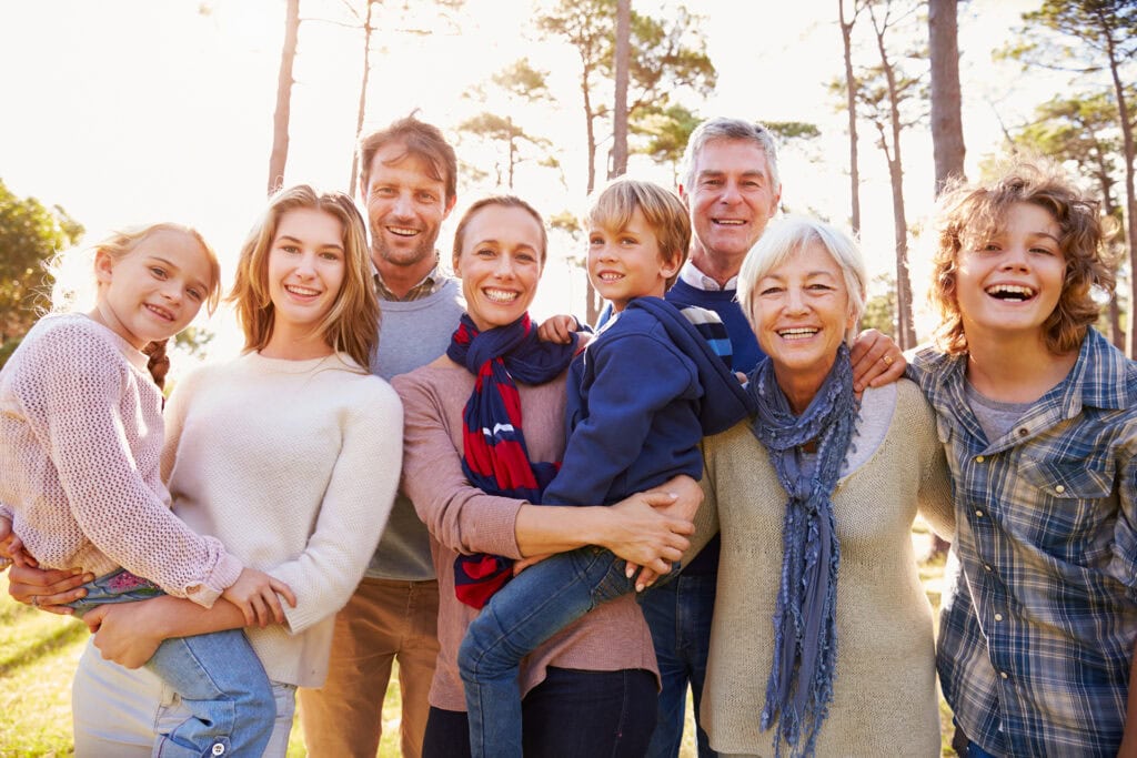 Multi-generation family talking on a bridge in a Memorial Forest