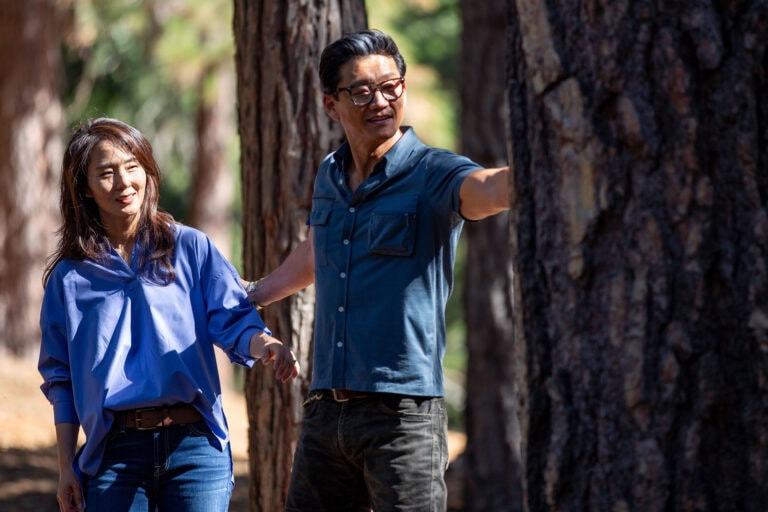 Brother and sister looking at Memorial Trees in a Memorial Forest