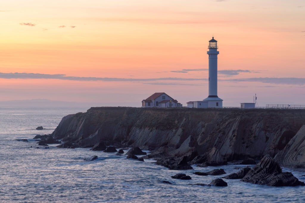 Point Arena Lighthouse at sunset in California county, United States of America