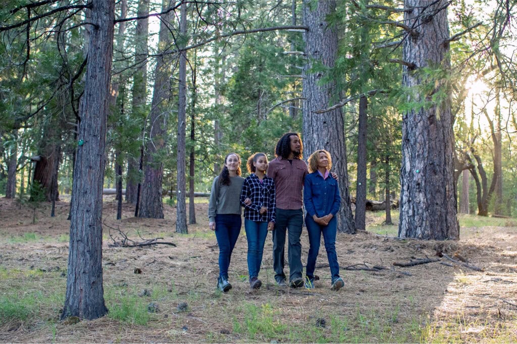 Family walking in a Memorial Forest to a Forest Memorial ceremony