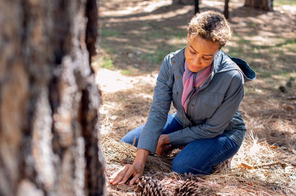 Widow in Memorial Forest visiting her husband at her Memorial Tree