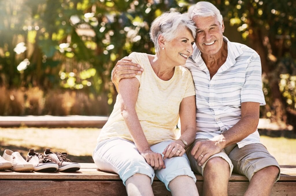 Older couple embracing discussing end of life plans