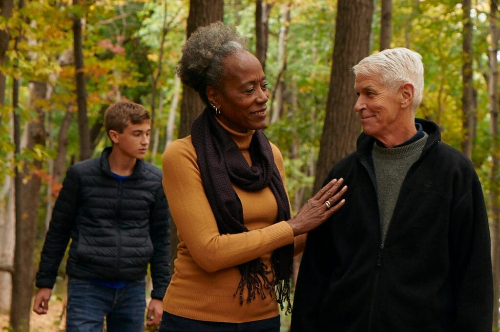 Woman comforts man in a memorial forest