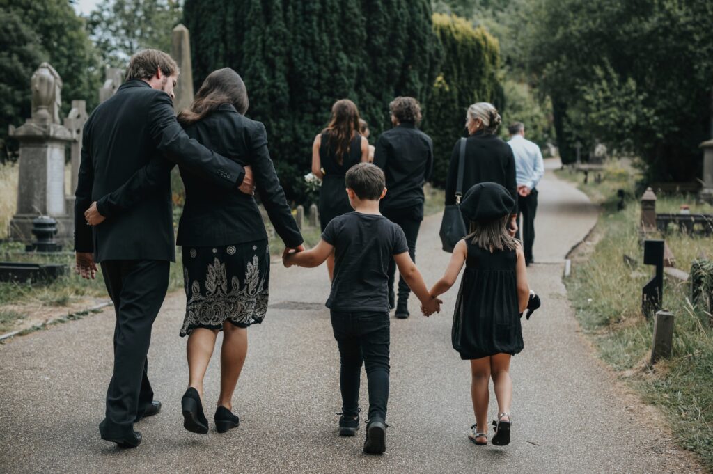A family walks together to attend a memorial service