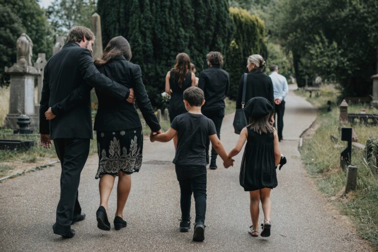 A family walks together to attend a memorial service