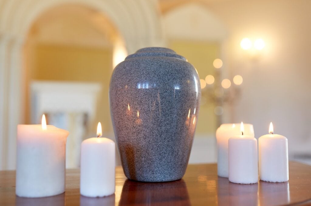an urn with soft warm candles