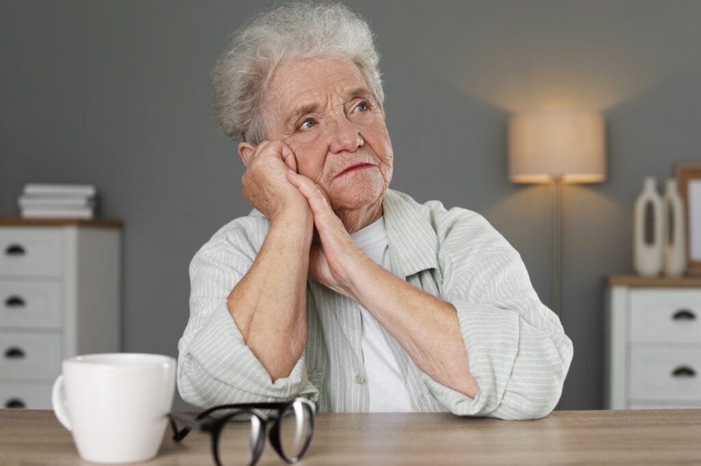 elderly woman grieving