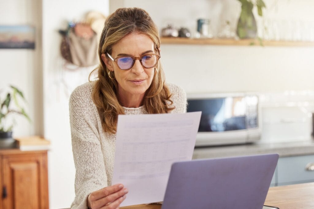 A woman reads through a checklist for essential steps for afterlife care