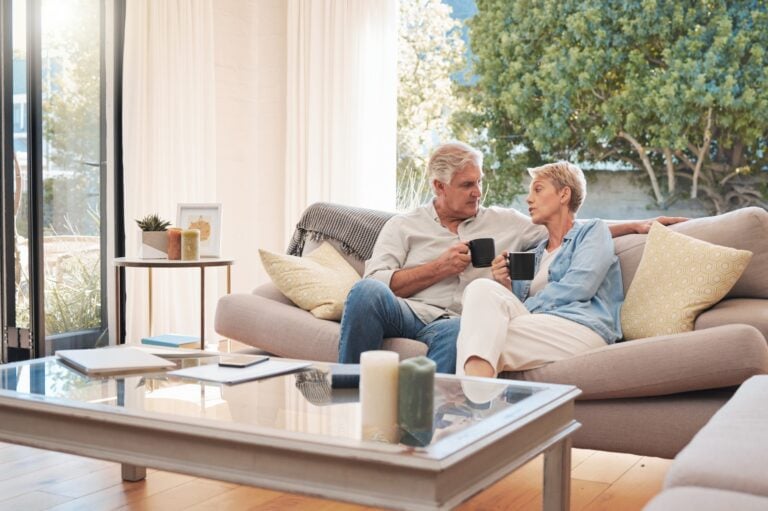 An elderly couple sits together for end of life planning