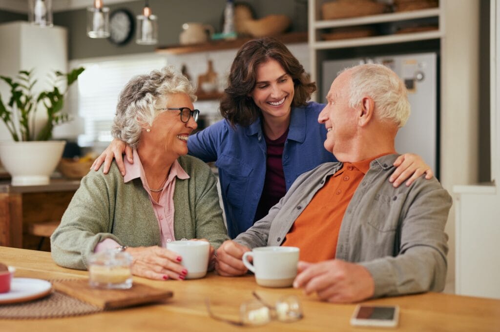 An elderly couple with their daughter discuss their final wishes in their home