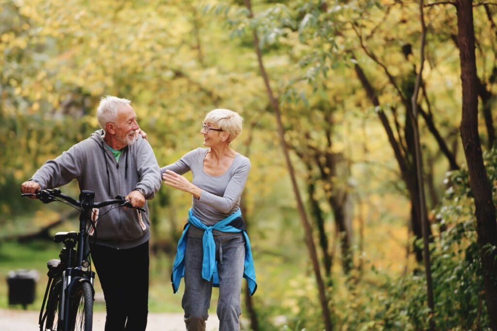 Older Couple exercising in park