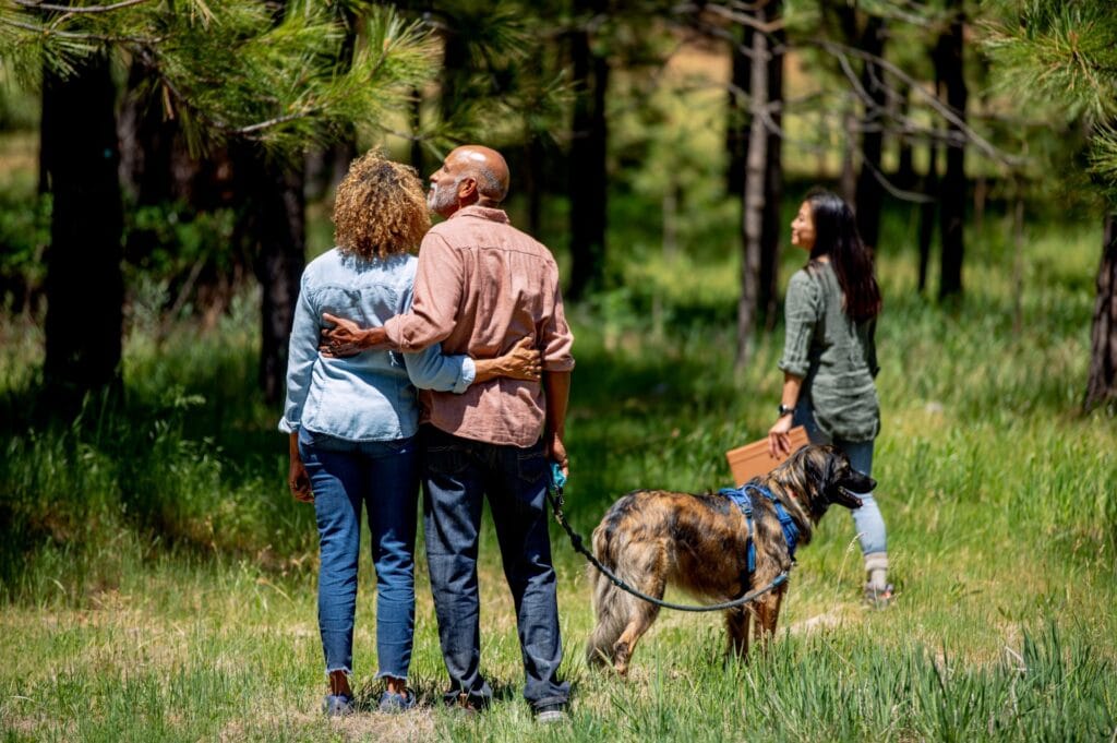 A Family looks out into a memorial forest