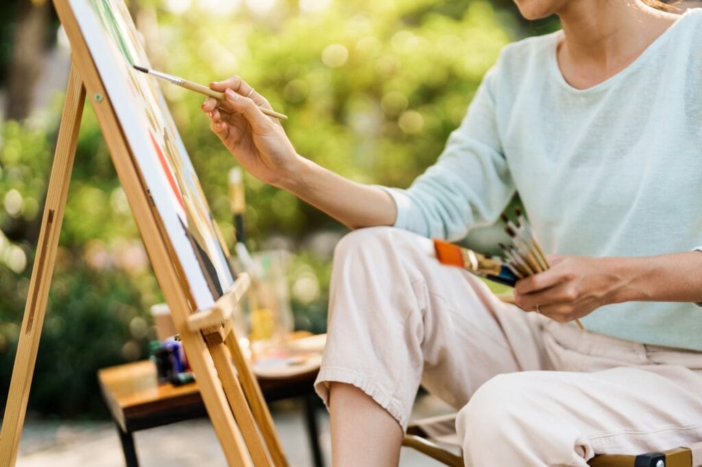 A woman doing art therapy for grief