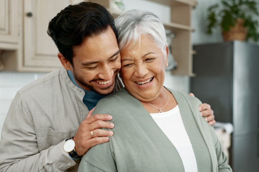 An elderly woman spending time with her son