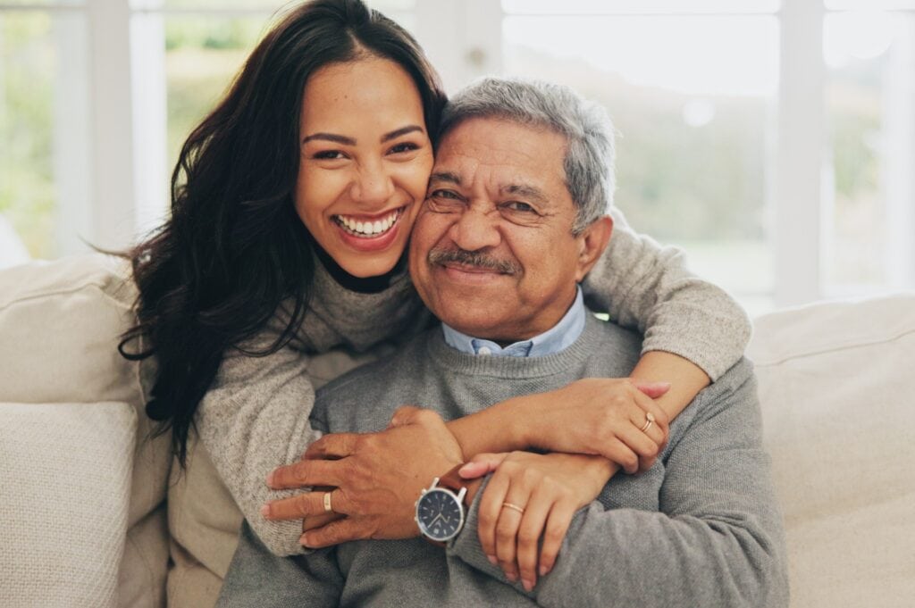 An elderly man spending time with his daughter