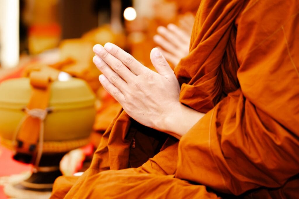 A Buddhist statue by a pond