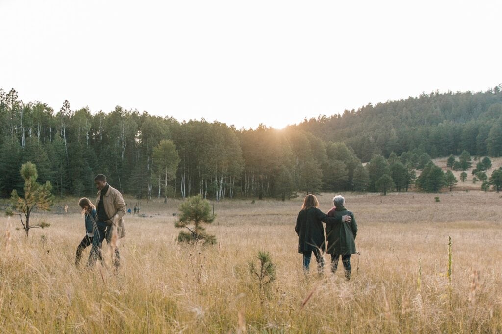 A family scattering ashes in a memorial forest in Arizona