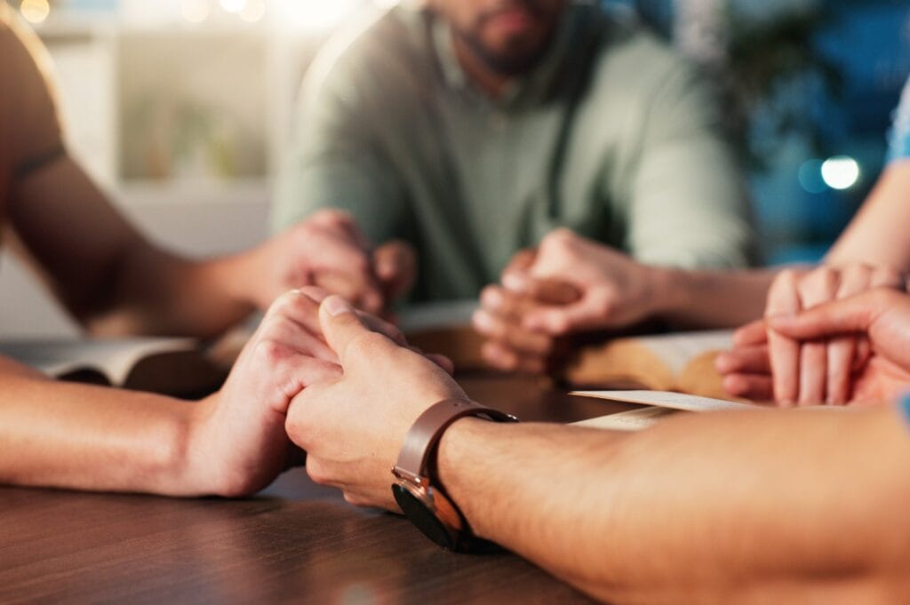 A group of Christians gather in remembrance of a deceased