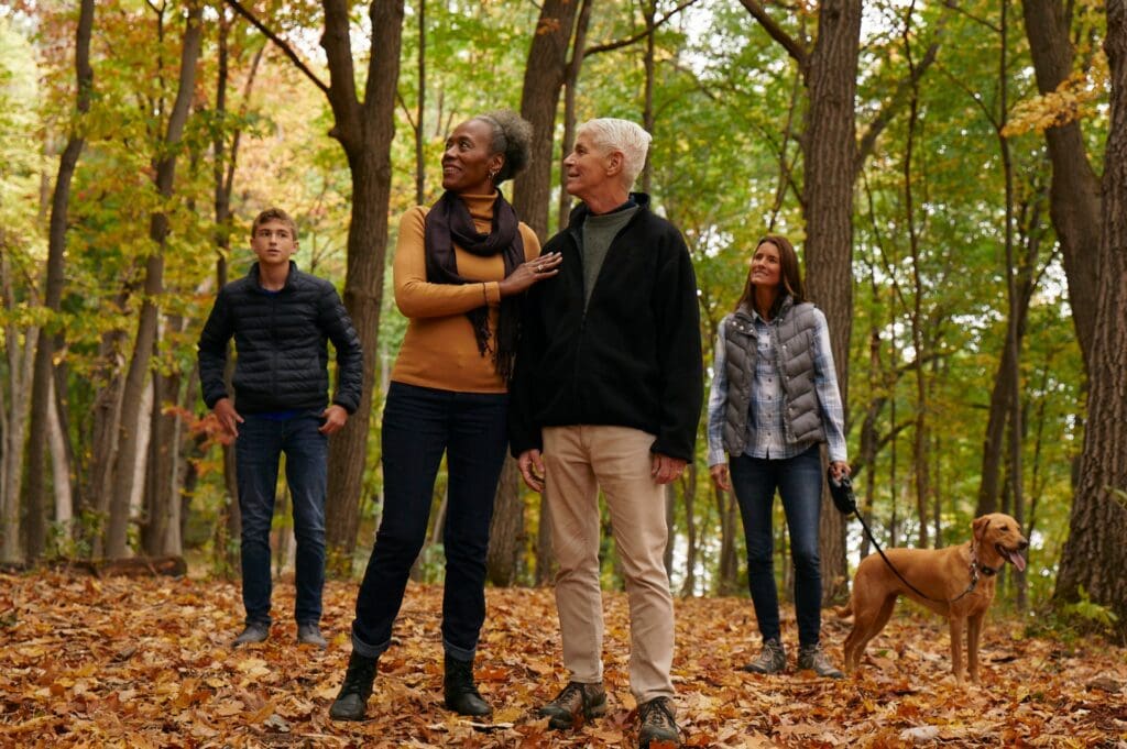 A family enjoying a walk through St.Croix Valley Memorial Forest