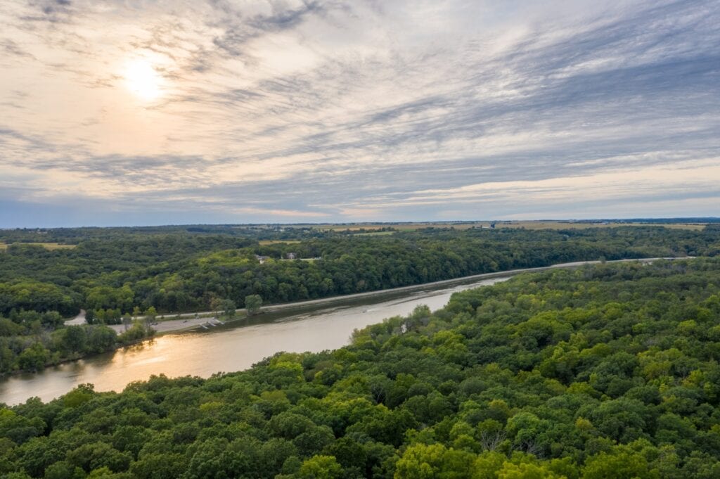 Aerial view of a rivering running through Rock River Memorial Forest
