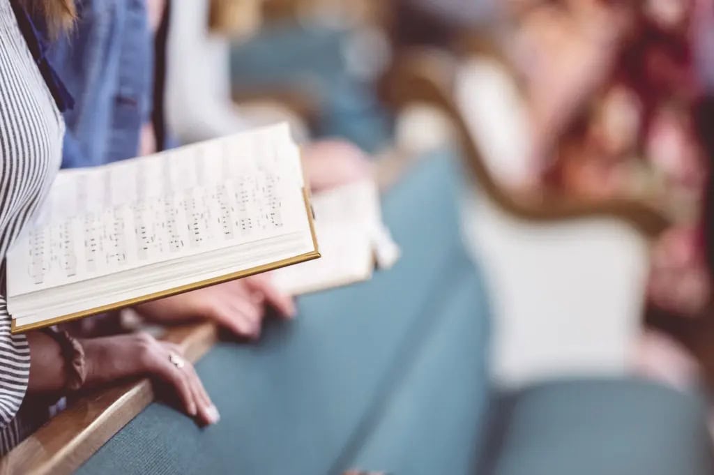 Choir singing religious songs at a funeral