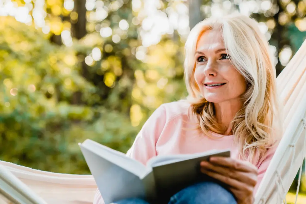A woman reading a book about life after death