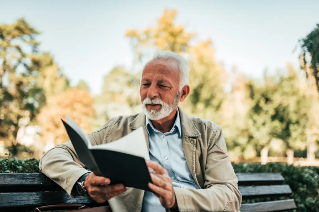 A man reading a book about life after death