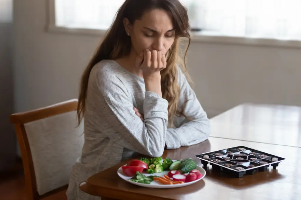 A grieving woman struggles to eat
