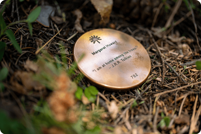 Close-up of a customized Memorial Marker installed at the base of a Memorial Tree.