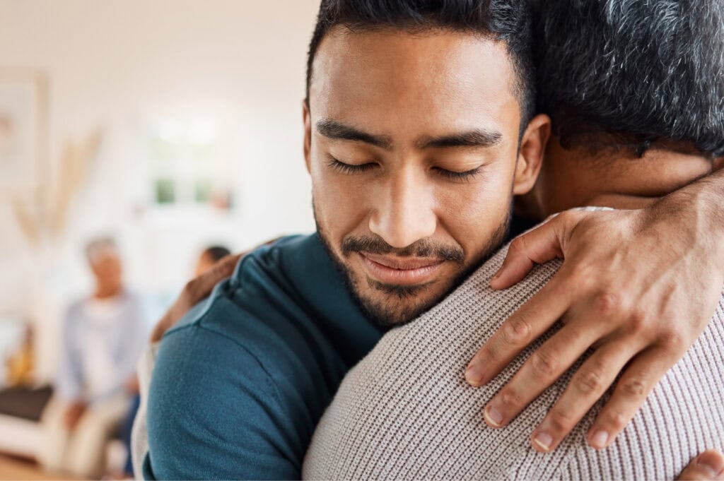 Two people embracing in a comforting hug.